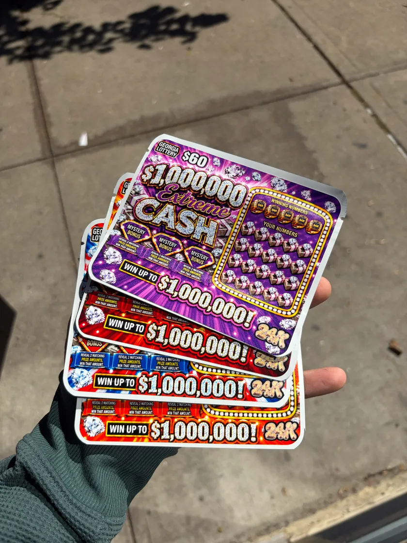 Hand holding colorful scratch card shaped packaging