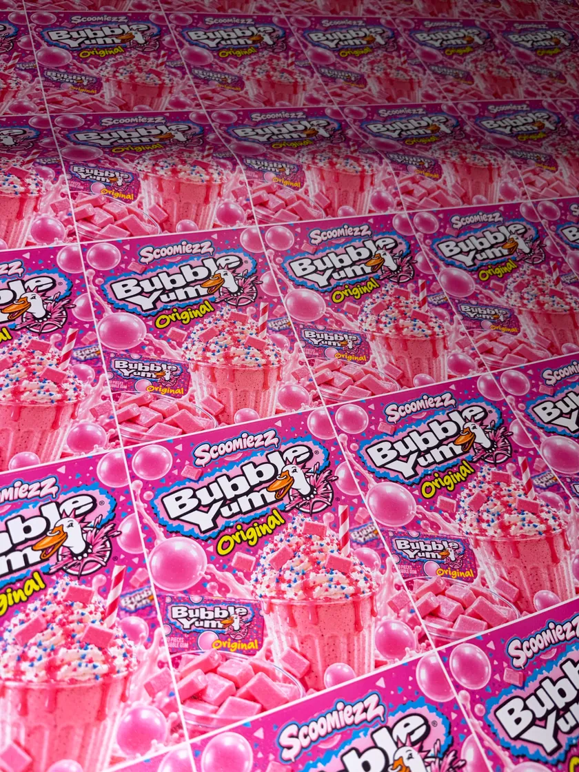Pink candy themed mylar packaging arranged in rows